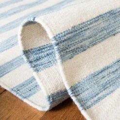 Safavieh Coastal Blue & Ivory Striped Hand Loomed Area Rug -Famous Furniture Store coastal blue and ivory striped hand loomed area rug rugs the well appointed house 4 e51b4086 051a 4097 8c1d 0d2afb3448a0