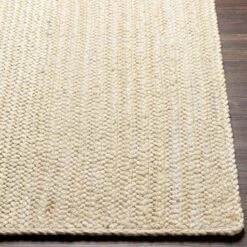 Cream Braided Jute Rug, Available In A Variety Of Sizes -Famous Furniture Store cream braided jute rug available in a variety of sizes rugs the well appointed house 4 db167b41 c6c9 43d3 885e 79b941d3c472