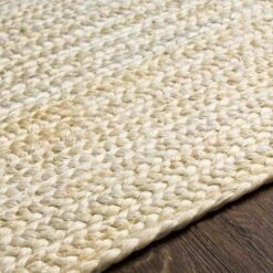 Cream Braided Jute Rug, Available In A Variety Of Sizes -Famous Furniture Store cream braided jute rug available in a variety of sizes rugs the well appointed house 7 c4c5ad3f 5469 47a4 be16 0cbd0a9130e9