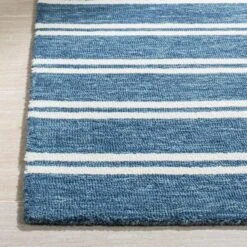 Safavieh Deep Blue & Ivory Hand Tufted Striped Area Rug -Famous Furniture Store deep blue and ivory hand tufted striped area rug rugs the well appointed house 3 54445a4d b218 446a 8be6 533fffe3d46f